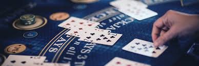 Live blackjack dealer at surga898 login table with player cards and chip rack visible